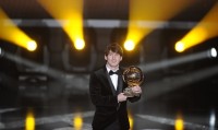 Argentina's Lionel Messi receives the FI